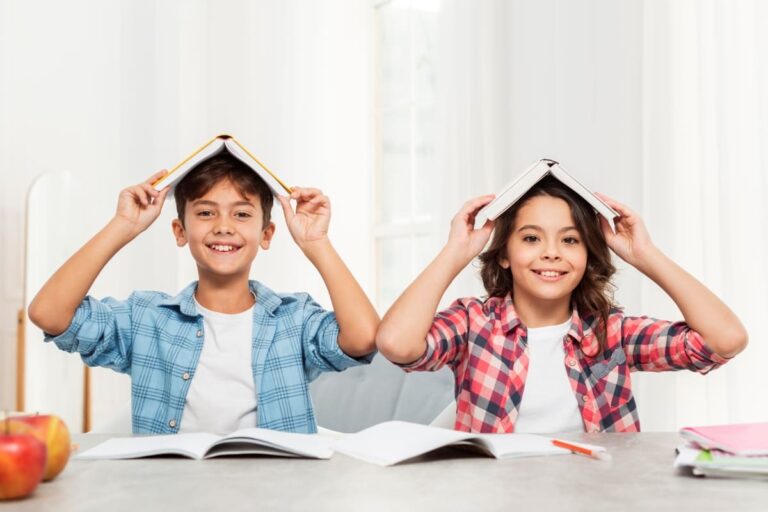 siblings-home-with-books-top-head (1)